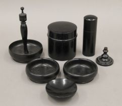 An ebony dressing table set. The largest piece 10 cm high.