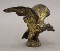 An early 20th century gilt bronze car mascot in the form of an eagle. 10 cm high.