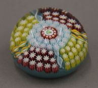A Perthshire glass paperweight with thistle cane to the centre and P cane to the base. 5.