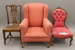 A pink upholstered wing-back chair, a spoon-back chair and a dining chair. The former 78 cm wide.