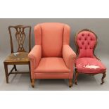 A pink upholstered wing-back chair, a spoon-back chair and a dining chair. The former 78 cm wide.