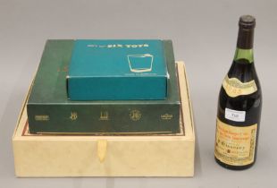 A bottle of 1985 Nuits-Saint-Georges premier cru, a boxed set of Cinzano,