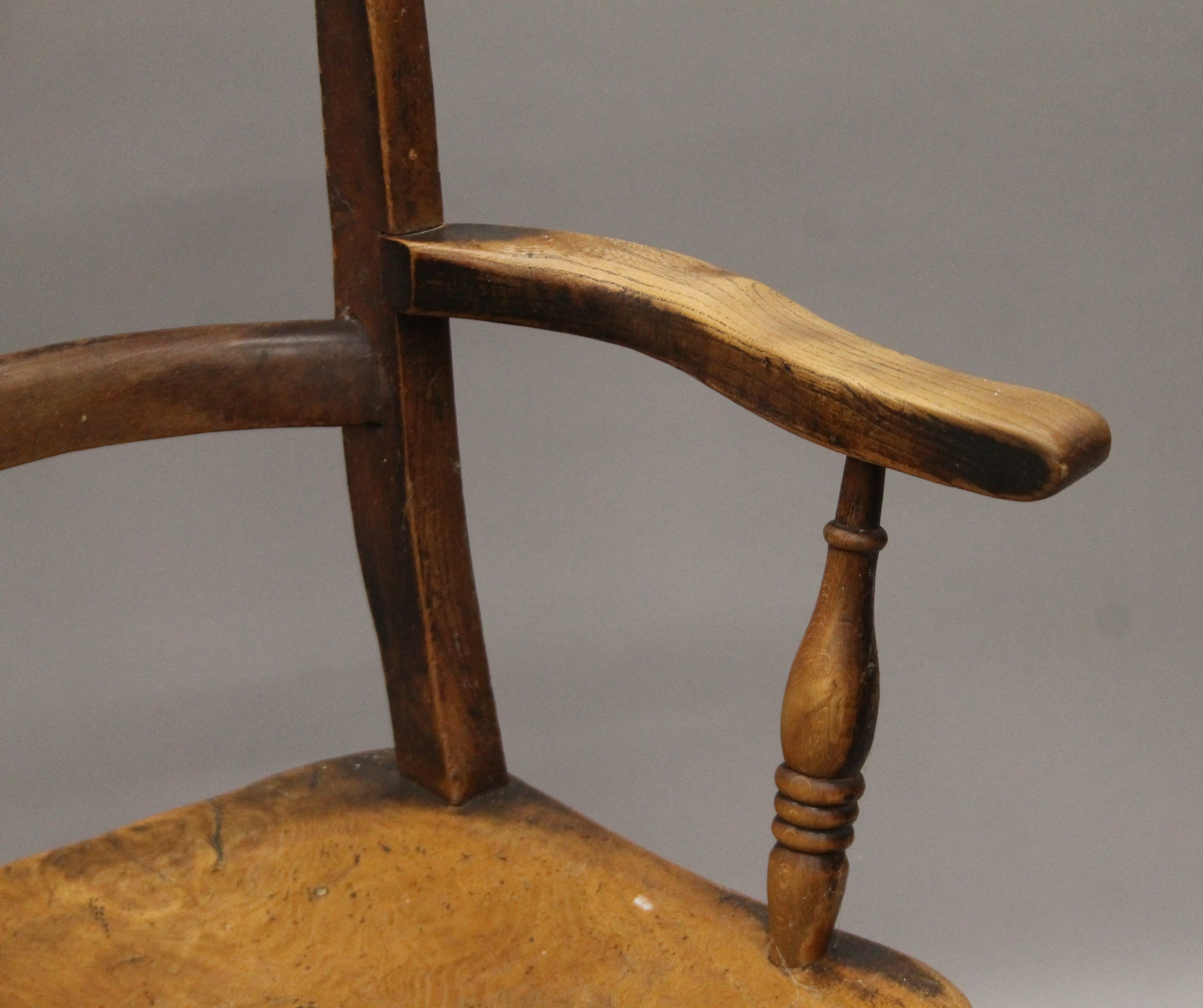 A 19th century elm seated open armchair. 56 cm wide. - Image 4 of 5