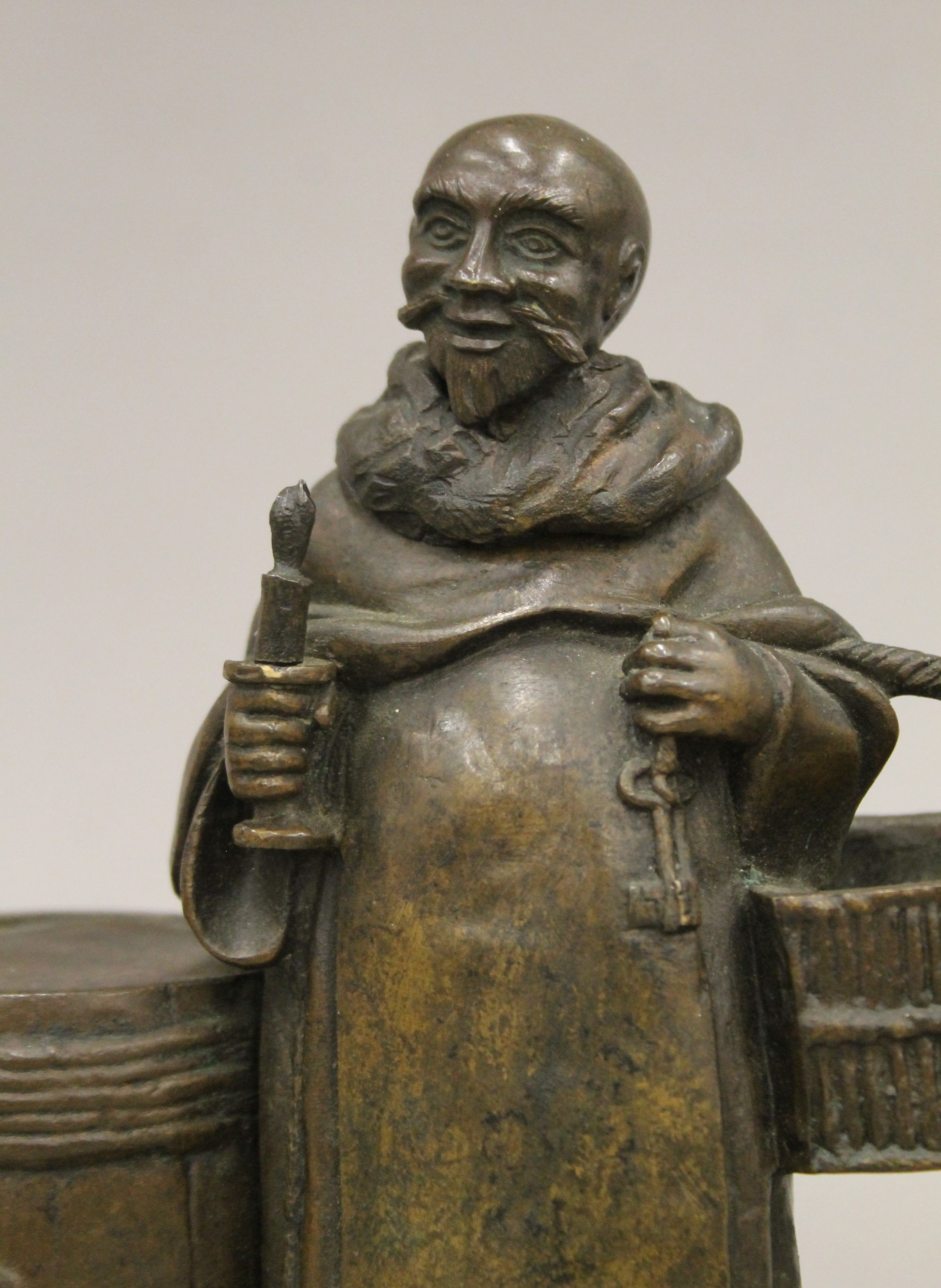 A cast bronze figure of a friar monk holding a key and candle. 18.5 cm high. - Bild 2 aus 6