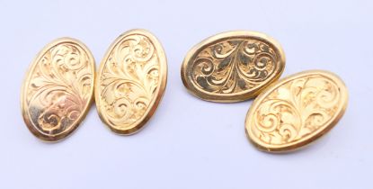 A pair of silver gilt cufflinks. 2 cm high.