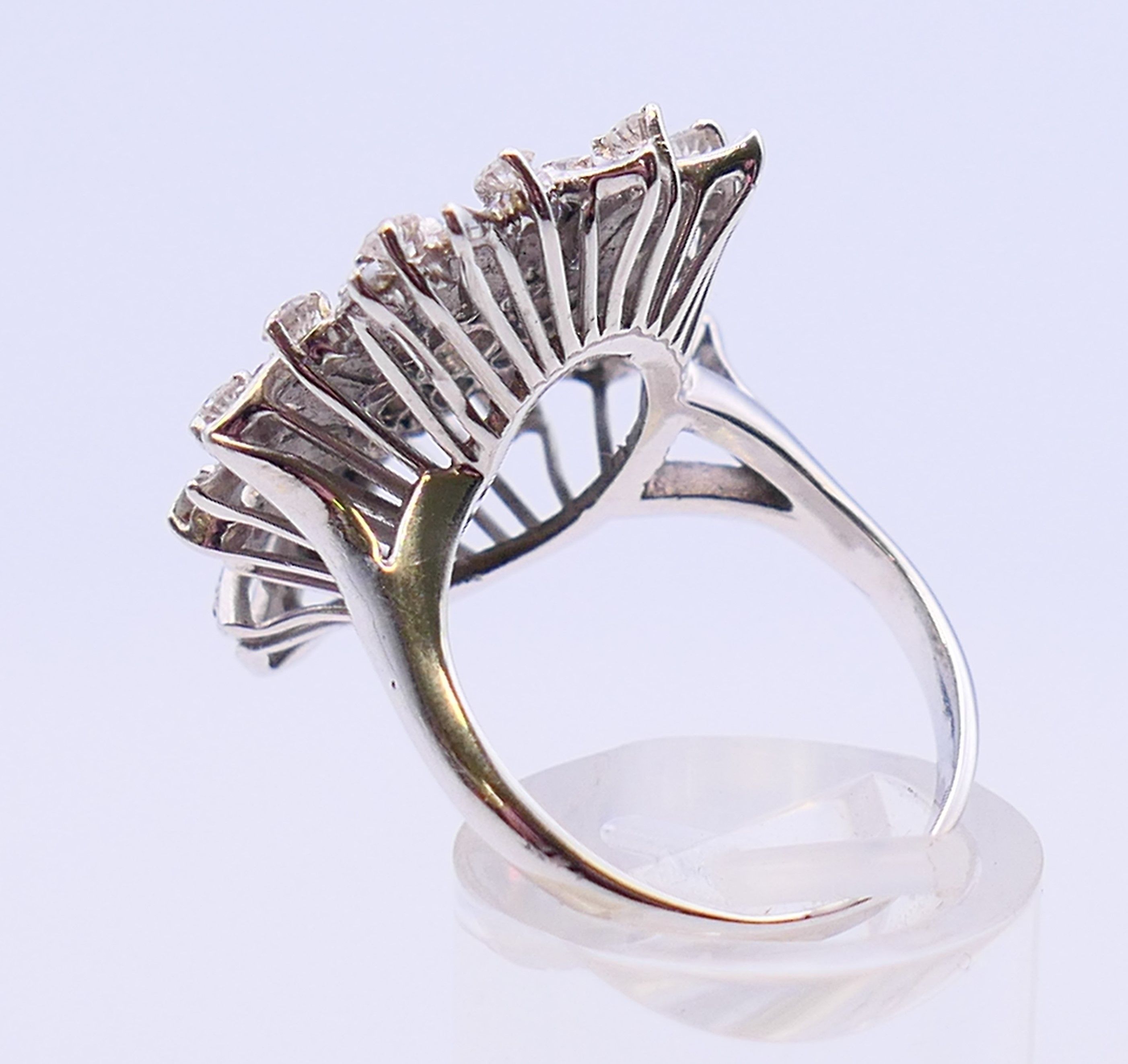 An unmarked platinum or white gold, diamond floral spray ring. 3cms long. Ring size Q/R. - Image 5 of 6
