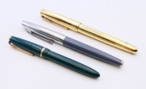 Two fountain pens and a Parker ballpoint pen, the later 13.5 cm long.