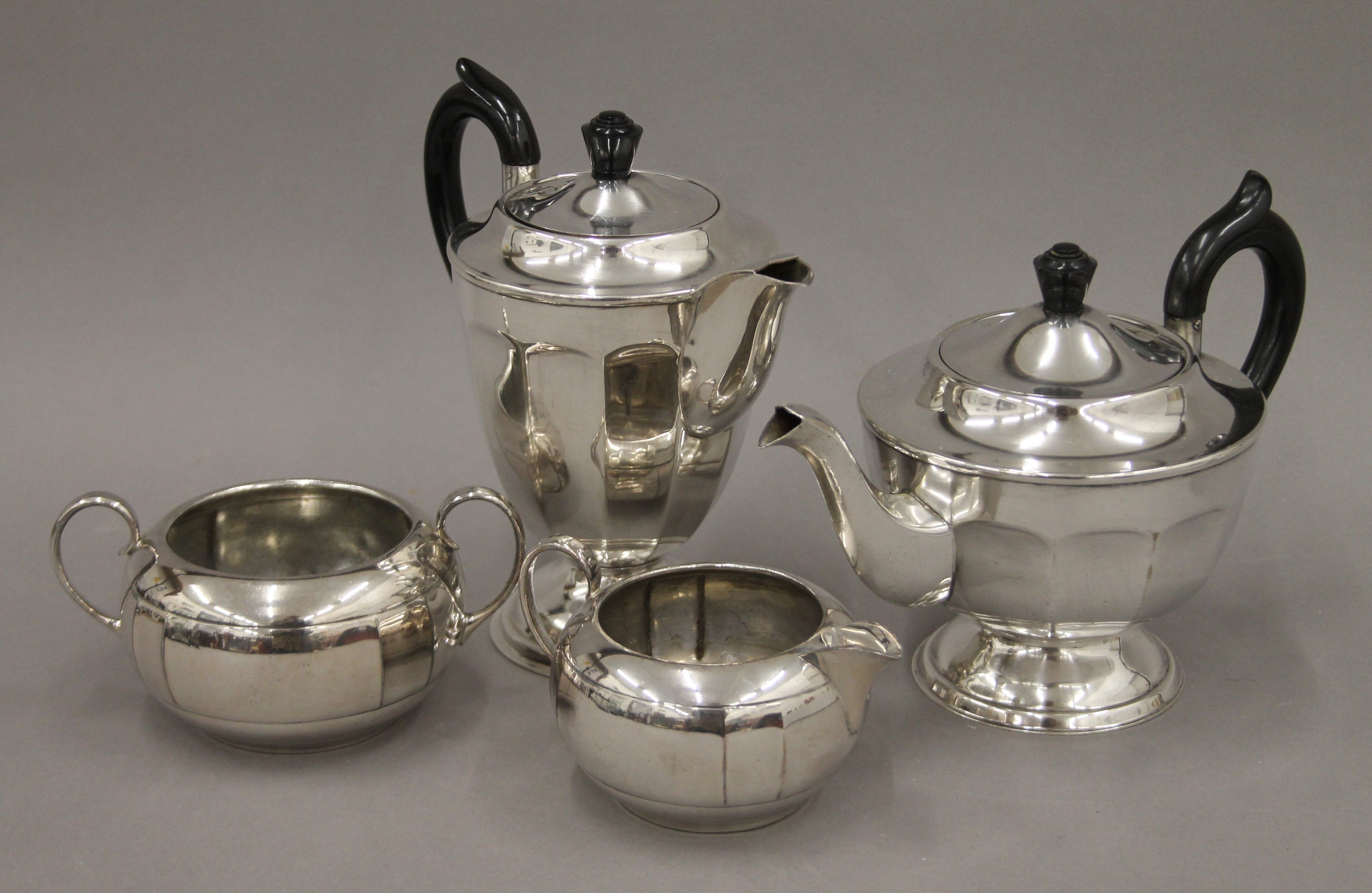 A Viners silver-plated teapot, coffee pot, sugar bowl and cream jug. The coffee pot 18 cm high.
