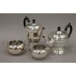 A Viners silver-plated teapot, coffee pot, sugar bowl and cream jug. The coffee pot 18 cm high.