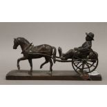 A 19th century bronzed model of a horse and carriage, signed J Bennett. 17.5 cm long.