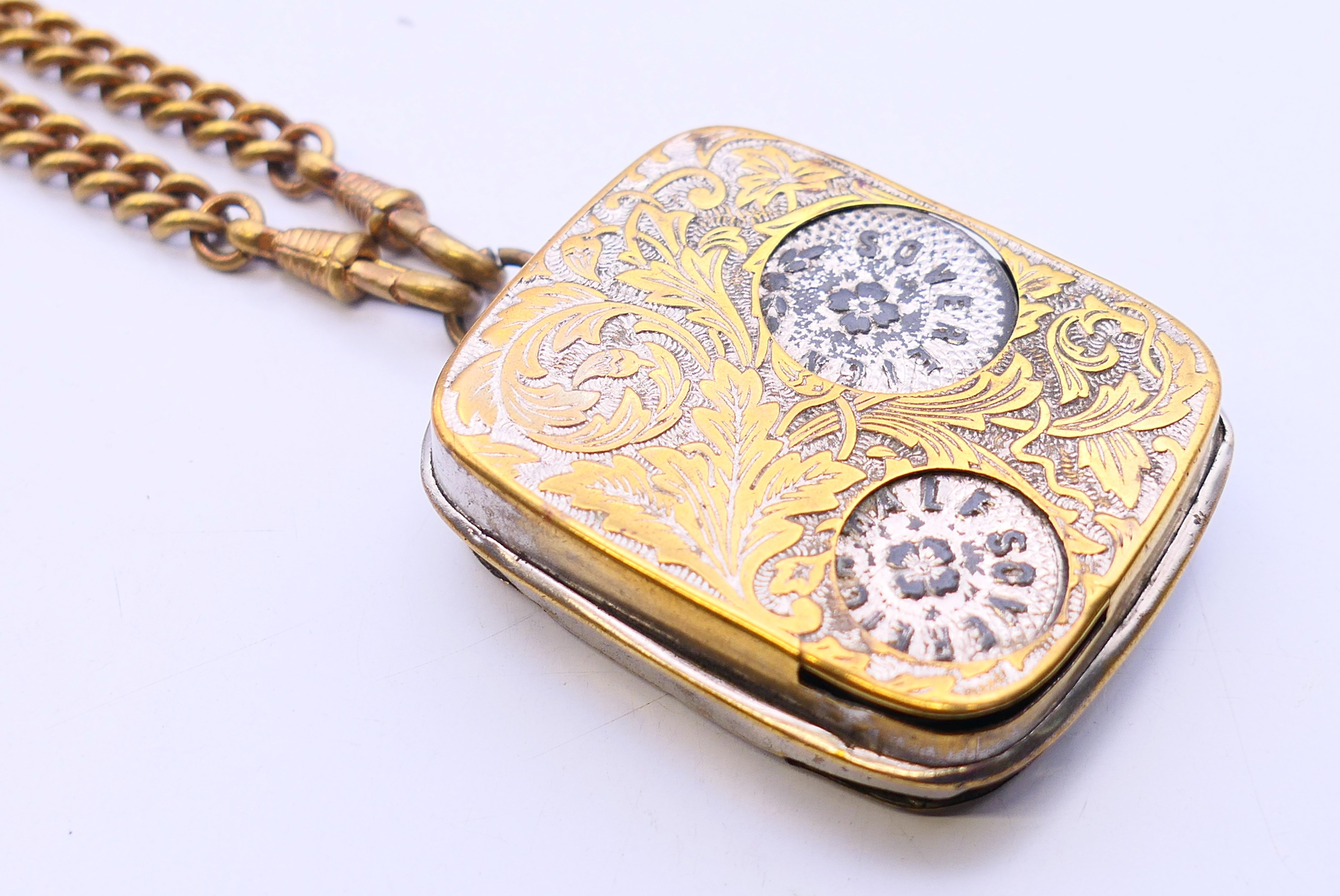An Edwardian coin dispenser on chain. 5 cm x 4 cm. - Image 3 of 5