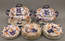 A 19th century part dinner service decorated in the Imari palette. The largest tureen 38 cm wide.
