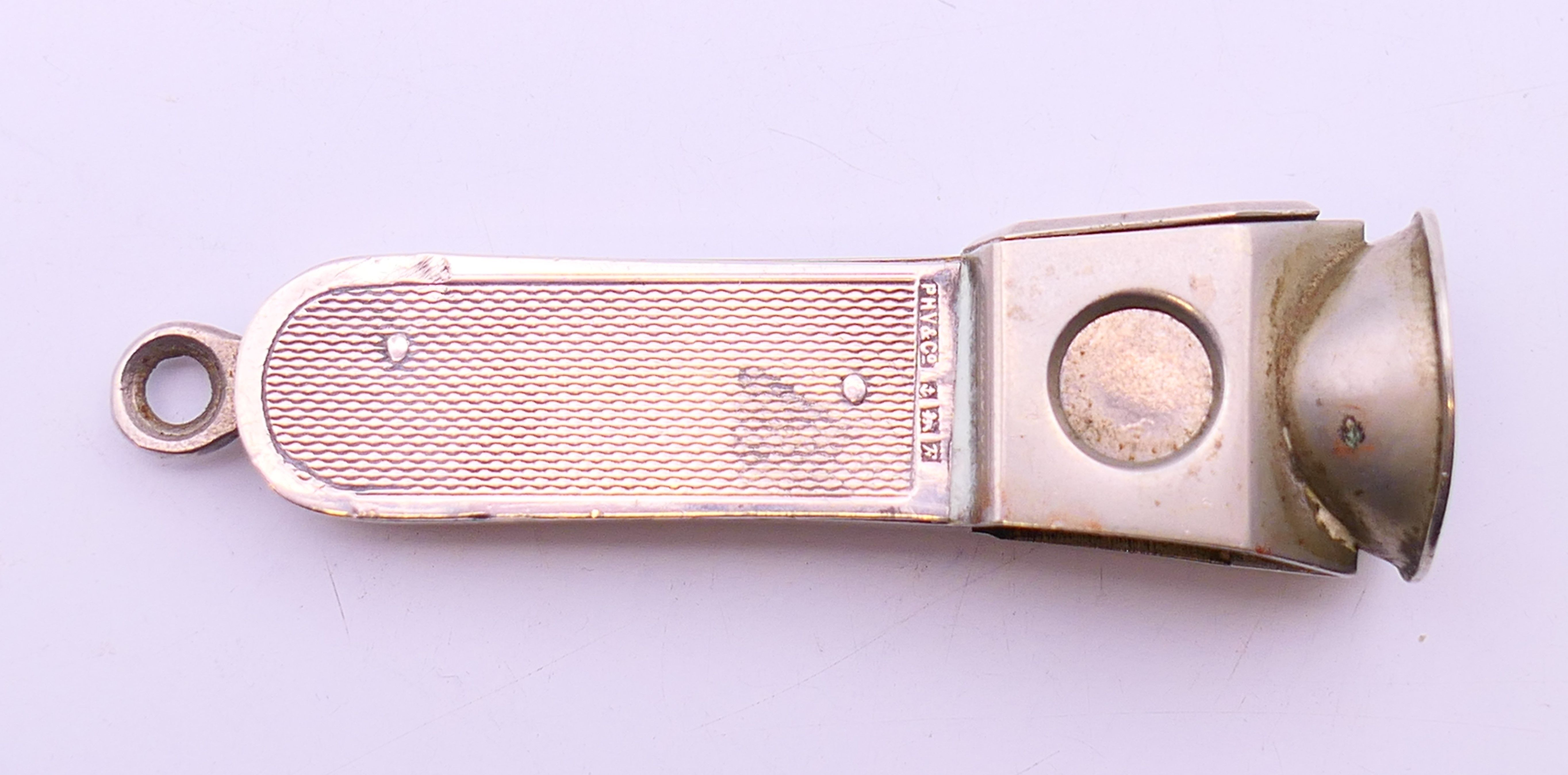 A silver cigar cutter. 7 cm high. - Image 3 of 6