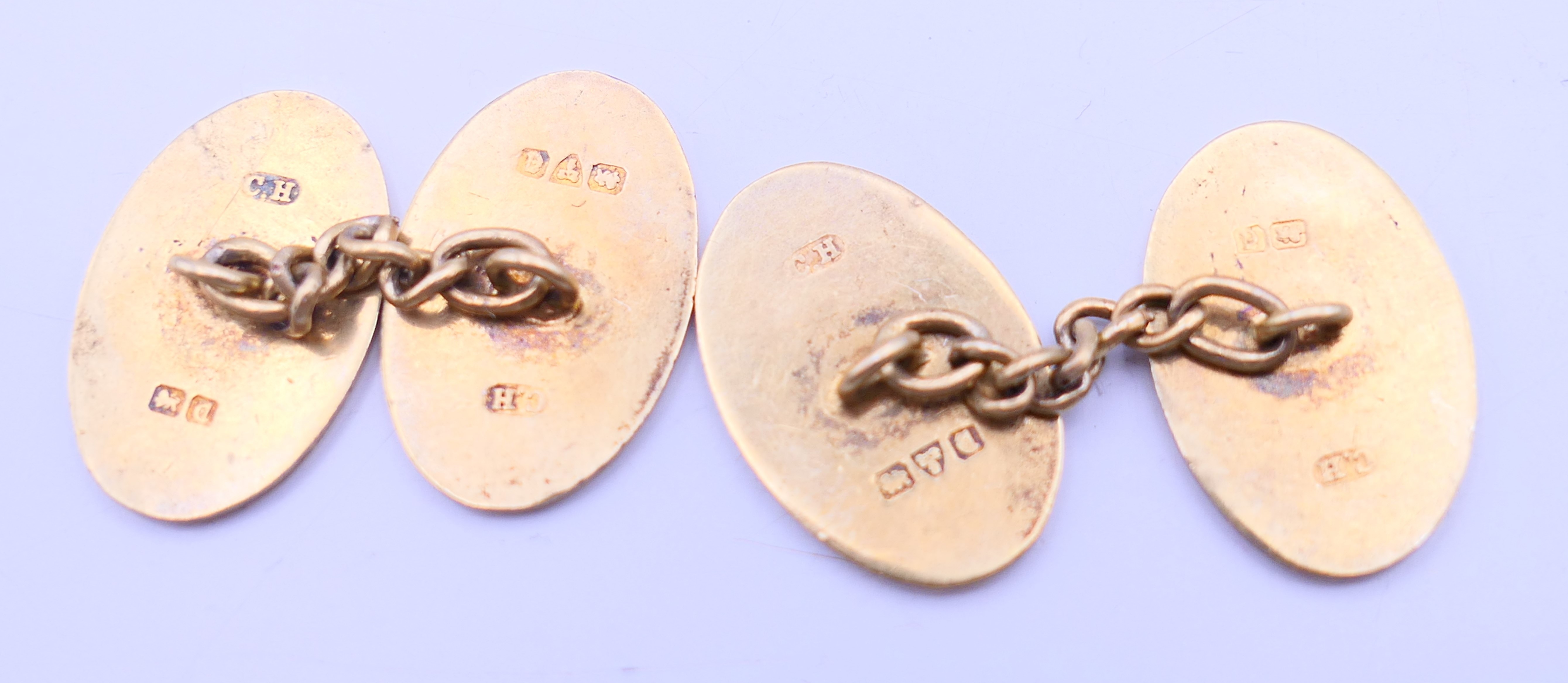 A pair of silver gilt cufflinks. 2 cm high. - Image 2 of 4