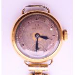 A 9 ct gold cased Omega ladies wristwatch. 2.5 cm diameter.