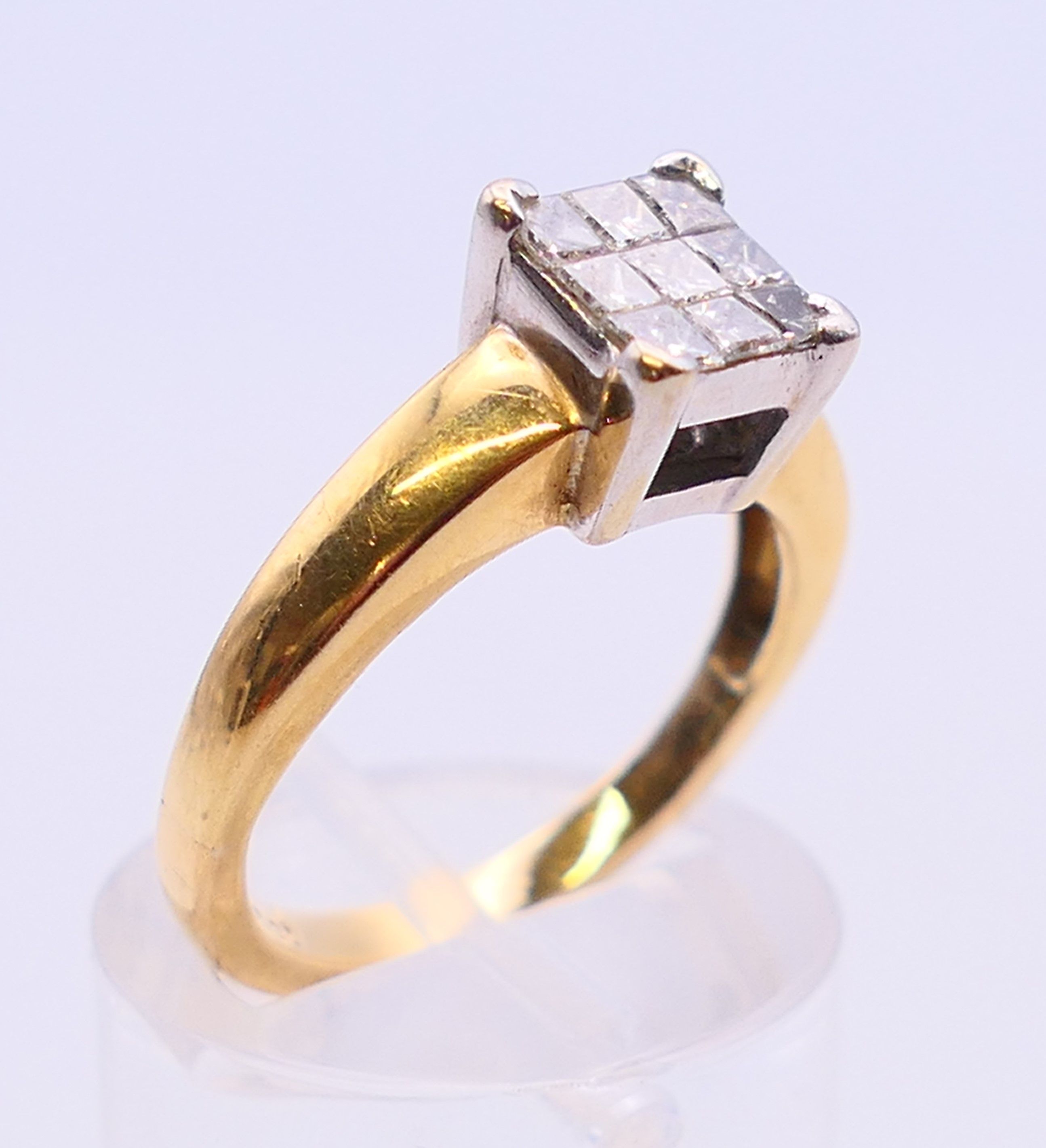 An 18 ct gold ring set with nine diamonds. together with a copy of a 2012 insurance valuation. - Image 3 of 8