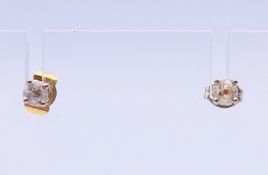 A pair of 18 ct gold old cut diamond ear studs, together with valuation papers. 0.4mm diameter.