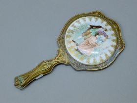 A Continental porcelain mounted hand mirror. 25 cm high.