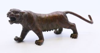 A bronze tiger. 13 cm long x 5 cm high.