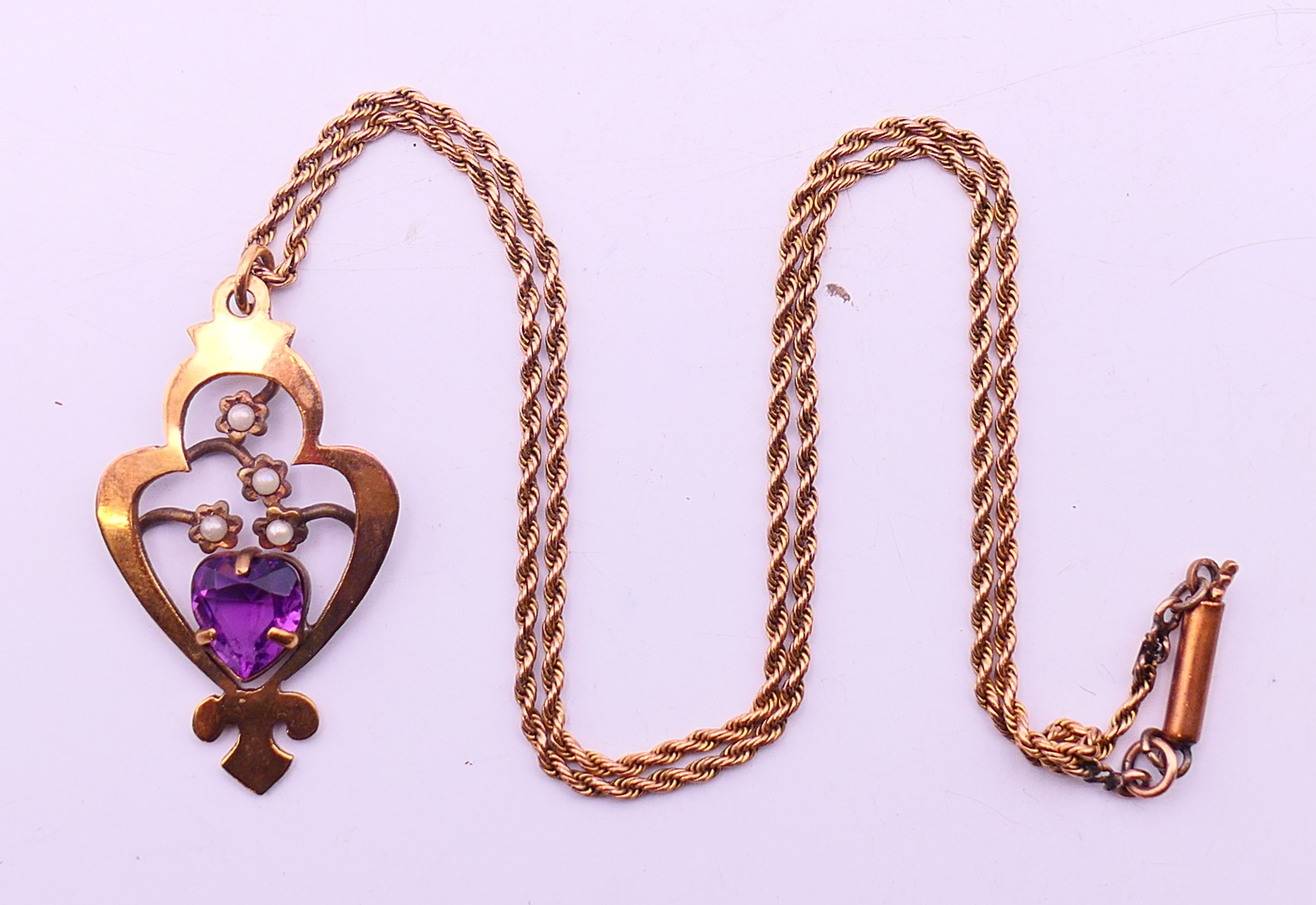 Two Edwardian pendant necklaces, one on a 9 ct gold chain, and a gilt metal and amethyst bracelet. - Image 10 of 14
