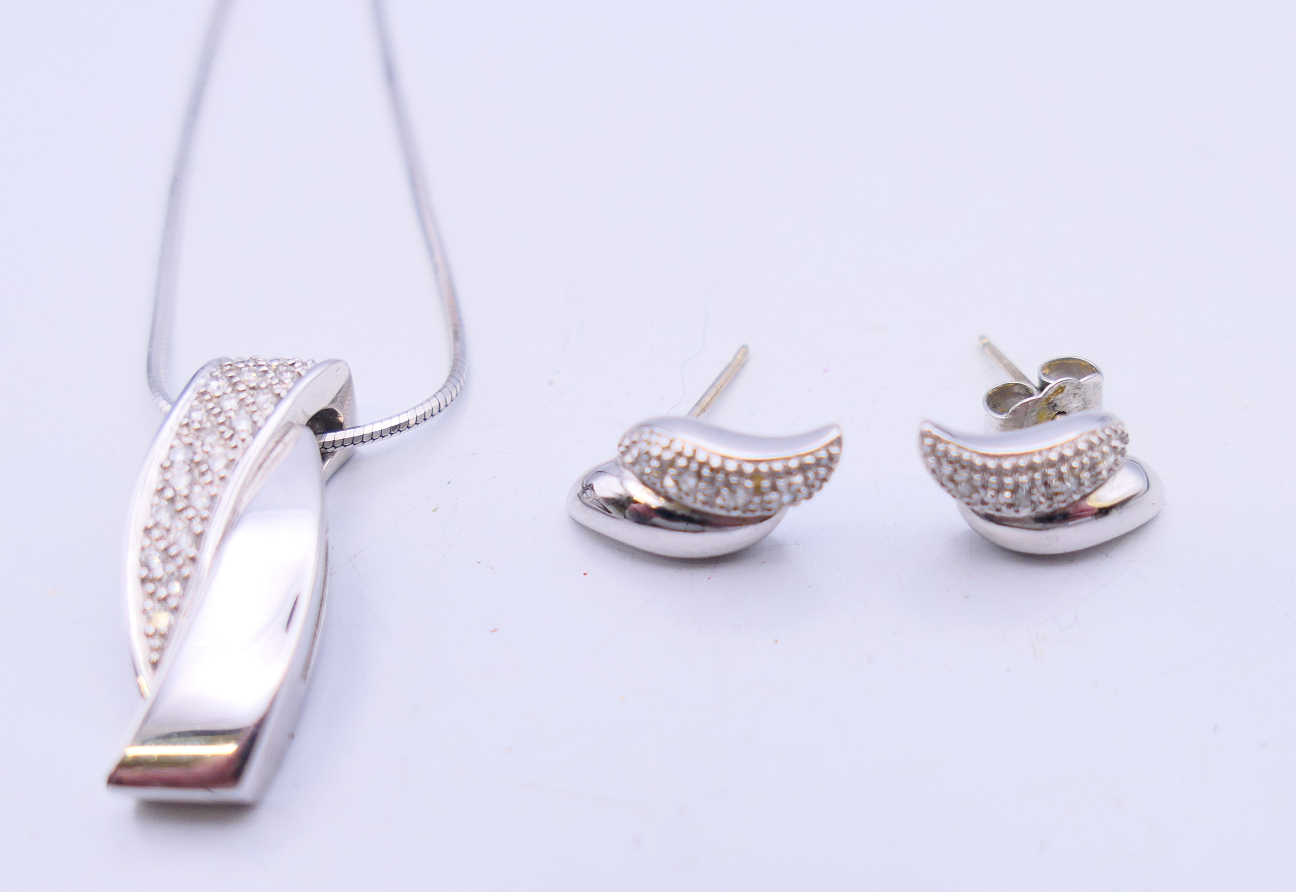 An 18 ct white gold and diamond pendant on an 18 ct white gold chain and a pair of 9 ct gold and - Image 2 of 13