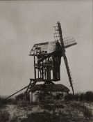 A photograph of a windmill, the reverse inscribed Madingley Cambs, framed and glazed. 21.5 x25 cm.