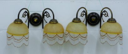 A pair of decorative twin branch wall lights. 40 cm wide.
