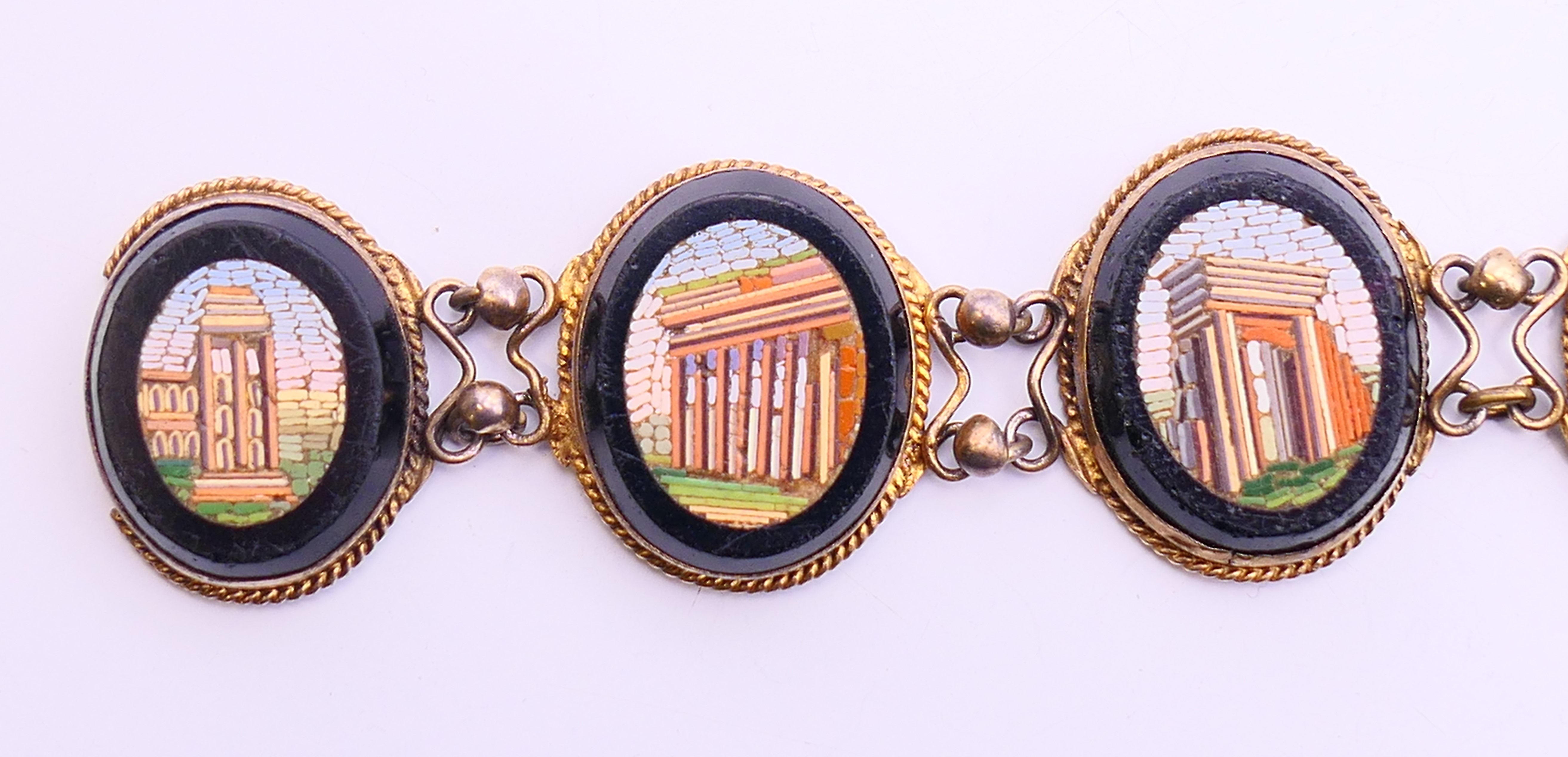 A 19th century micro-mosaic six panel brooch, the panels depicting Roman monuments. 18 cm long. - Image 4 of 8