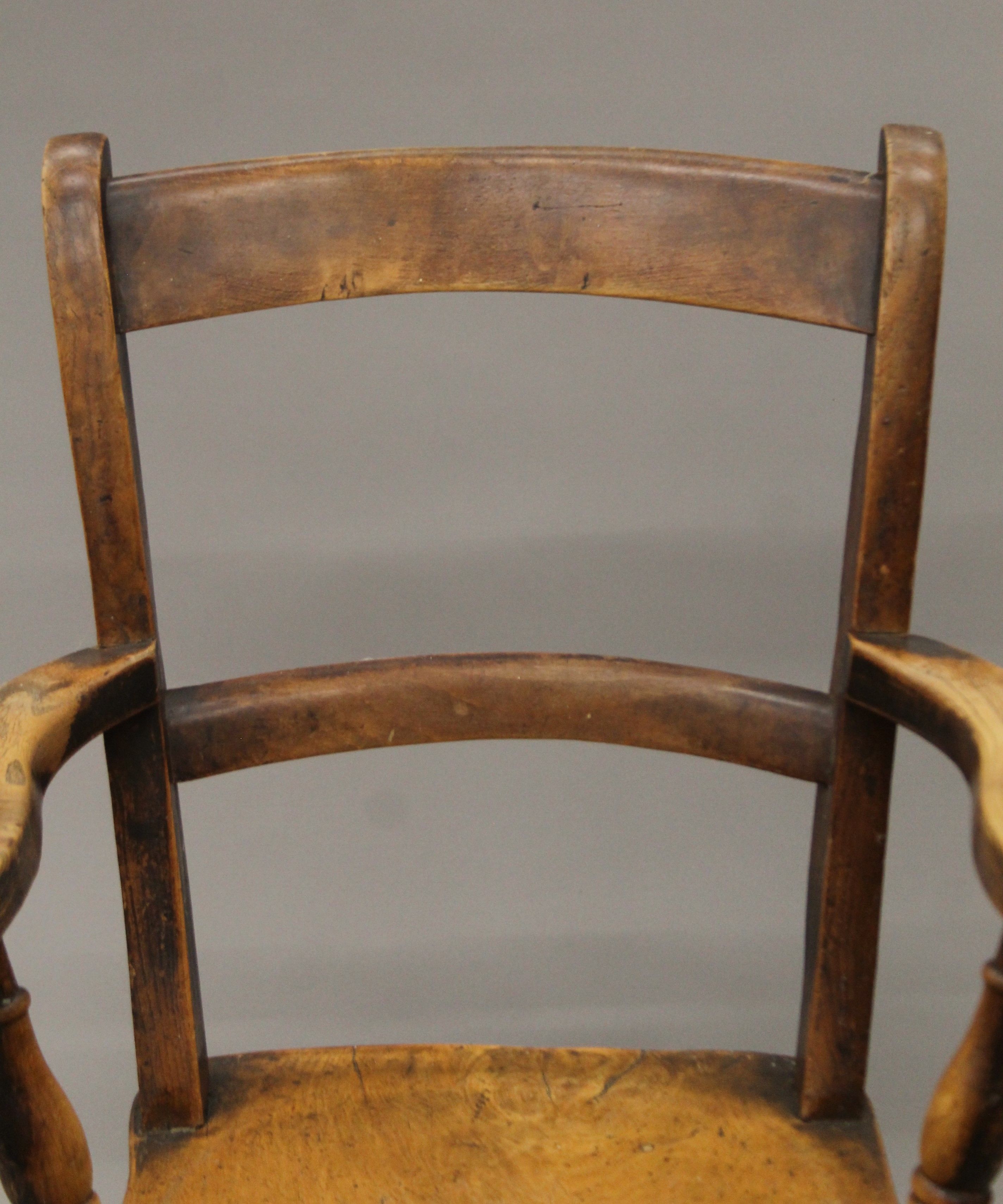 A 19th century elm seated open armchair. 56 cm wide. - Image 2 of 5