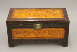 An Eastern carved trunk. 69 cm wide.