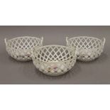 Three Loosdrecht florally painted porcelain baskets. The largest 18 cm wide.