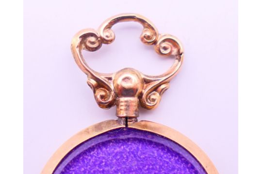 A 9 ct gold double photo locket pendant. 3.5 cm high including suspension loop. - Image 2 of 3