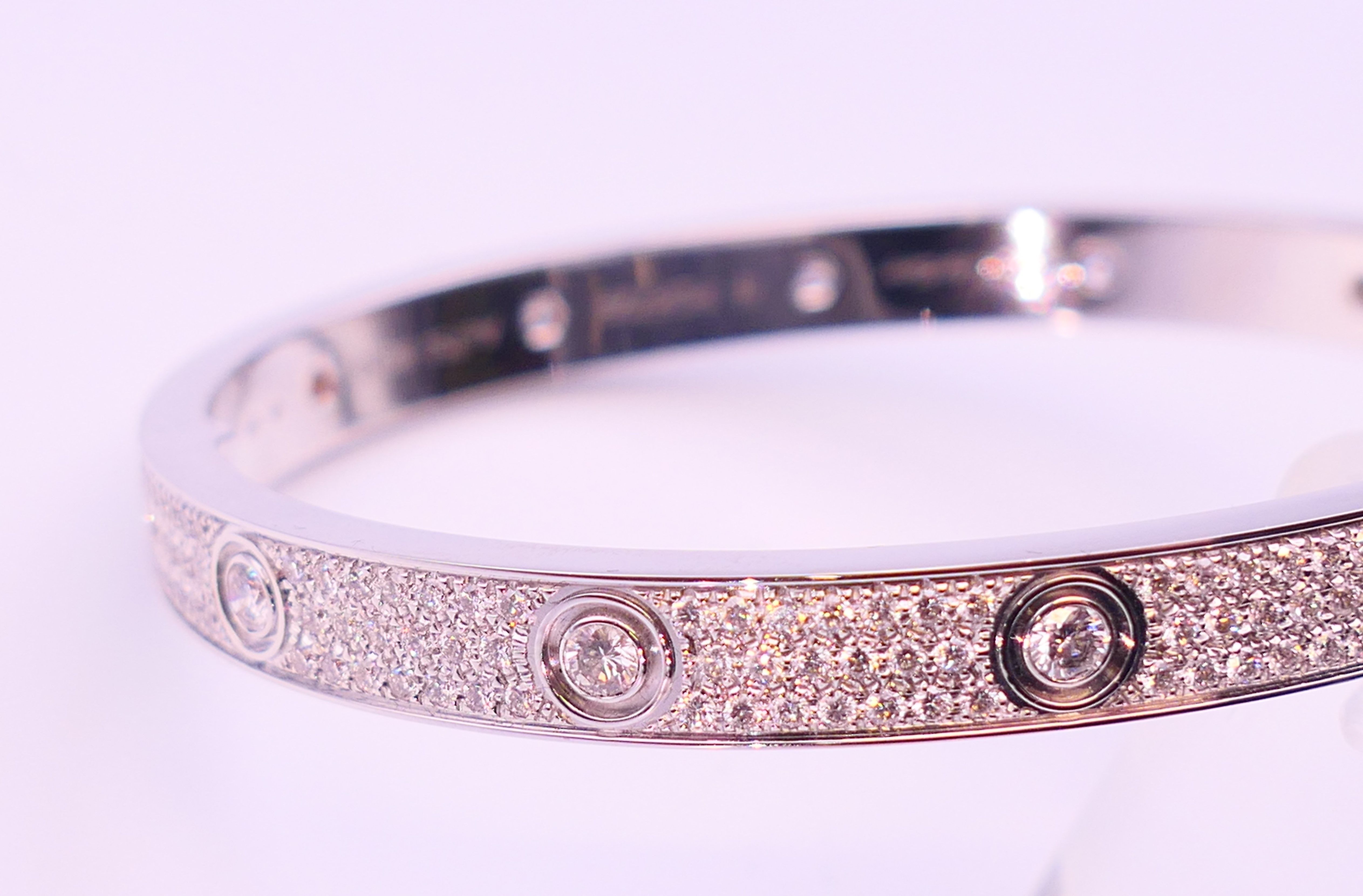 A Cartier 18 K white gold and diamond encrusted love bangle numbered 19 PDR729. 6. - Image 13 of 13
