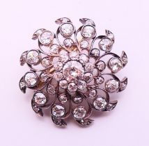 A pierced diamond pendant brooch, the centre stone spreading to approximately 0.75 of a carat.