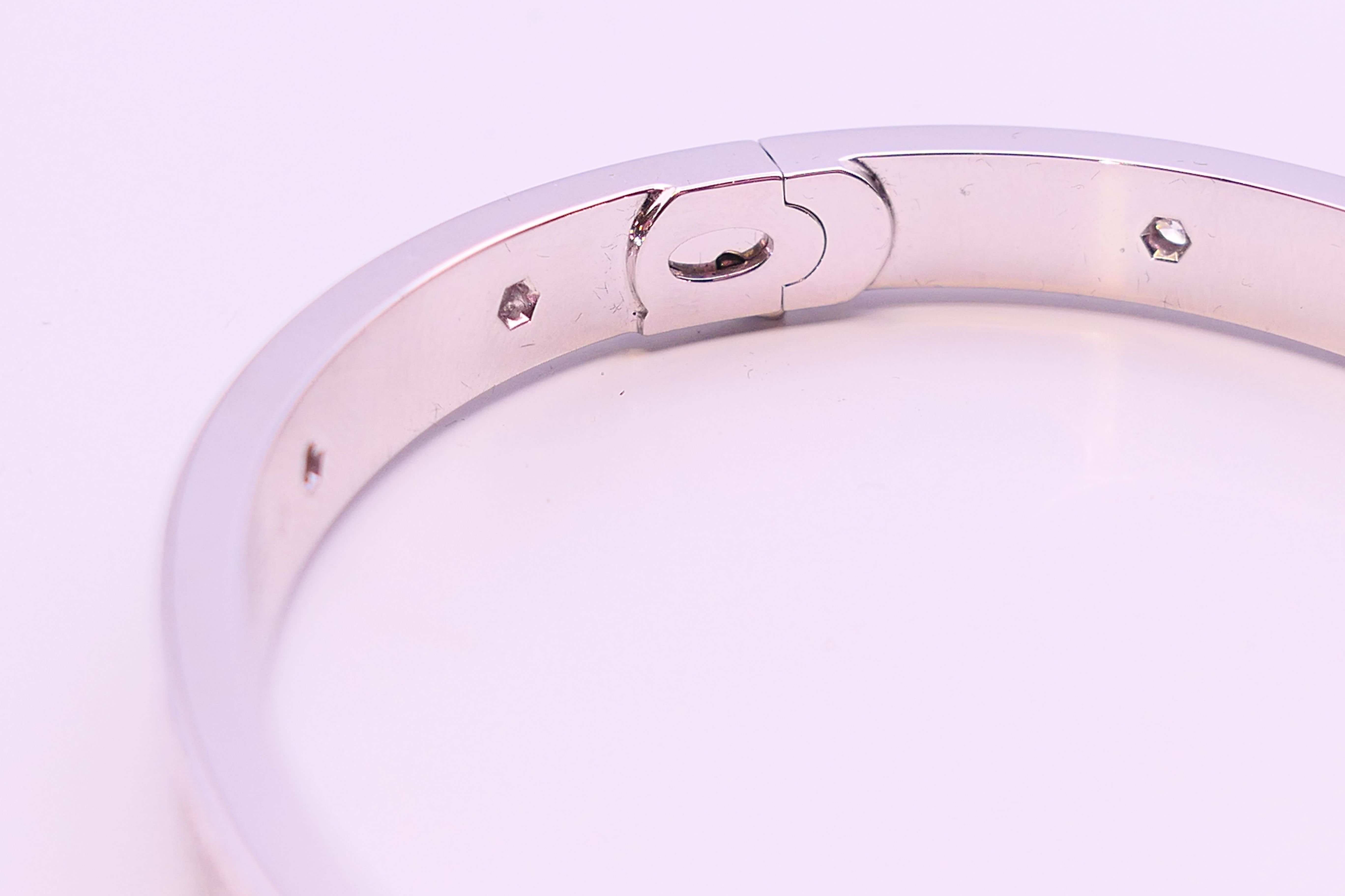 A Cartier 18 K white gold and diamond encrusted love bangle numbered 19 PDR729. 6. - Image 8 of 13