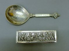 A 19th century Continental silver oblong box, the lid depicting children playing at jousting,