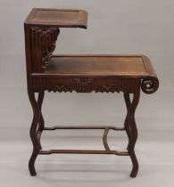 A Chinese hardwood two-tier table. 91 cm high.