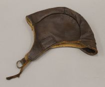 A vintage leather flying helmet. 28 cm long.