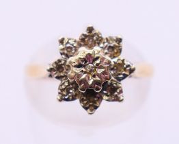 A 9 ct gold illusion set diamond ring. Ring size L/M.