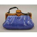 A Bourne Denby stoneware hot water bottle in the form of a ladies handbag. 25 cm long.