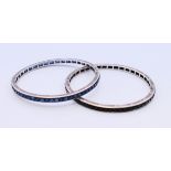 Two white metal bangles. 7.25 cm diameter (6.5 cm internal diameter).