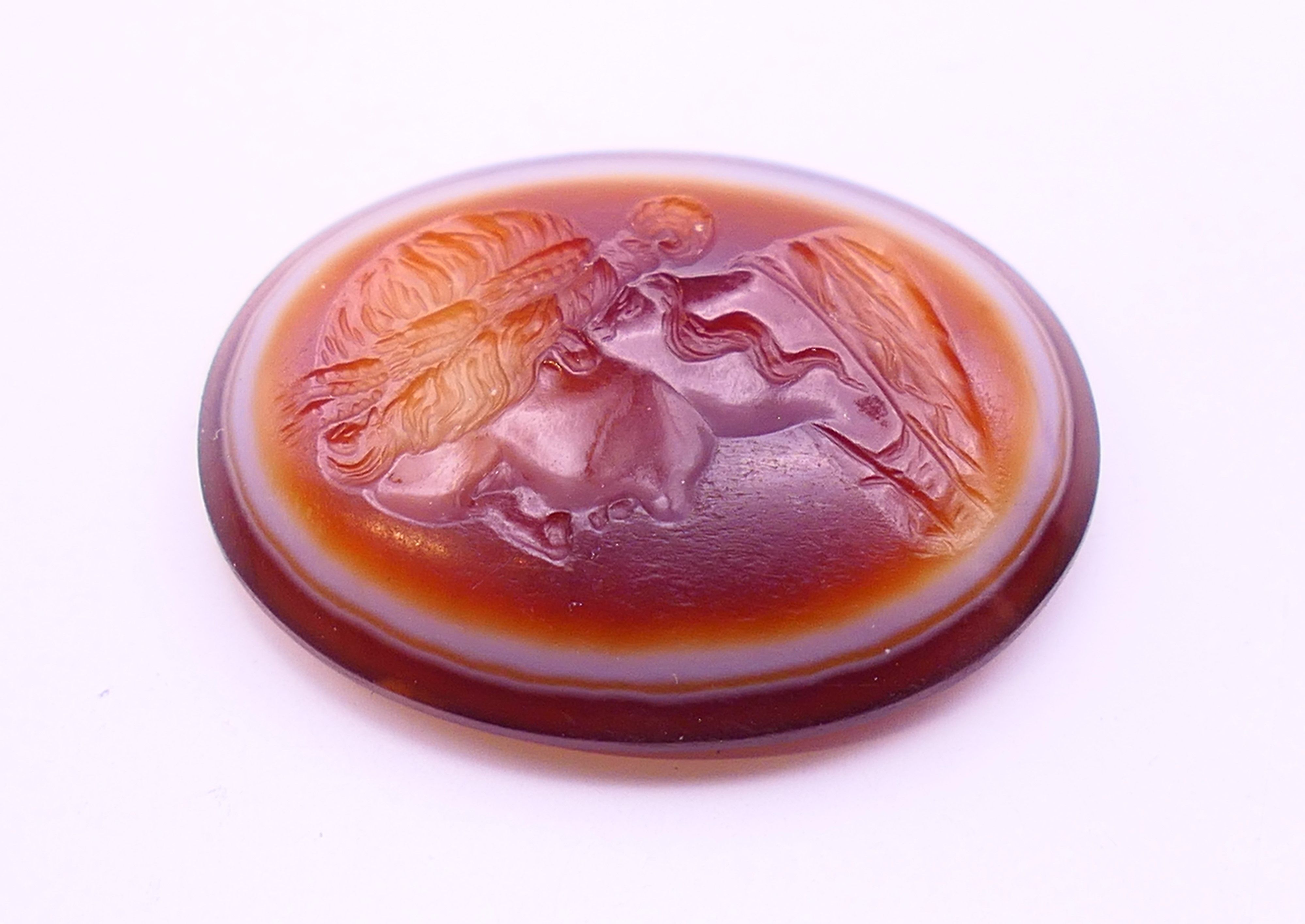 An antique banded agate intaglio carved with the profile of a Roman lady. 2. - Image 3 of 6