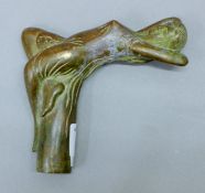 A bronze walking stick handle decorated with a girl. 9.5 cm high.