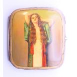 A silver cigarette case with girl decoration. 8 cm x 9 cm.