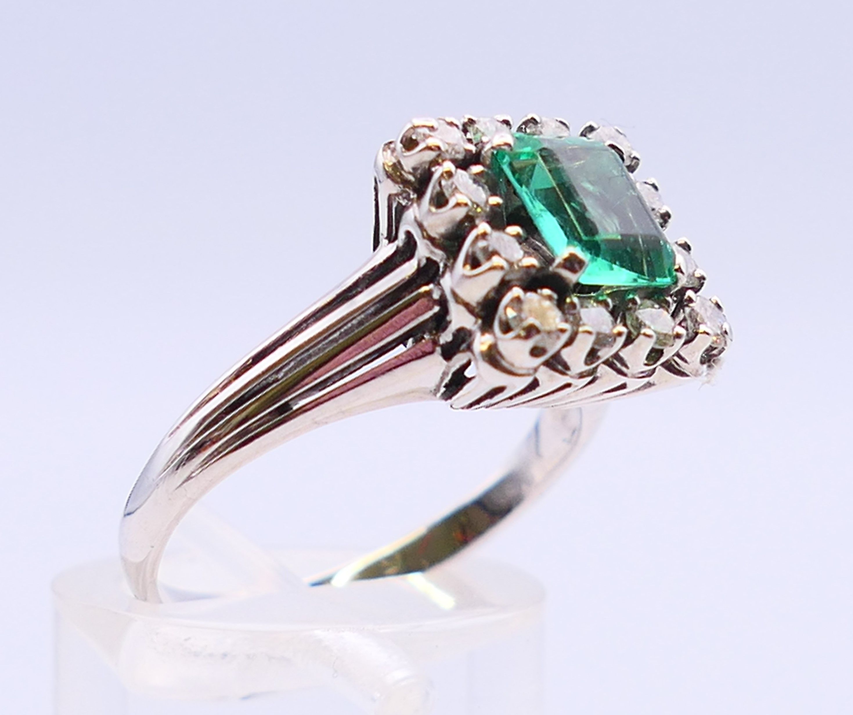 An unmarked 18 ct white gold, emerald and diamond ring. Ring size N/O. - Image 3 of 6