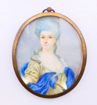 A 19th century hand-painted miniature portrait on ivory of a lady in a blue and olive-coloured
