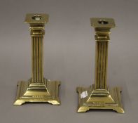 A pair of brass candlesticks. 18 cm high.