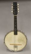 A John Alvey Turner banjo, cased. The banjo 60 cm long.