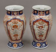 A pair of late 19th century Japanese Imari porcelain vases. 24.5 cm high.