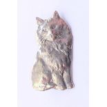 A silver brooch in the form of a cat. 3 cm high.